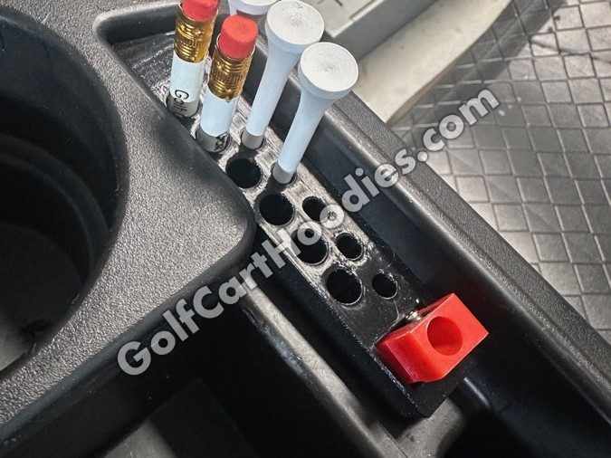 Golf tee and pencil holder with tees and pencils in a Yamaha dash